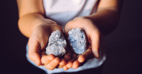 holding clusters blue crystals called Celestite