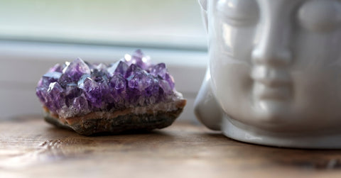 purple stone with white buddha head