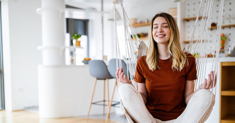 woman practicing yoga at home