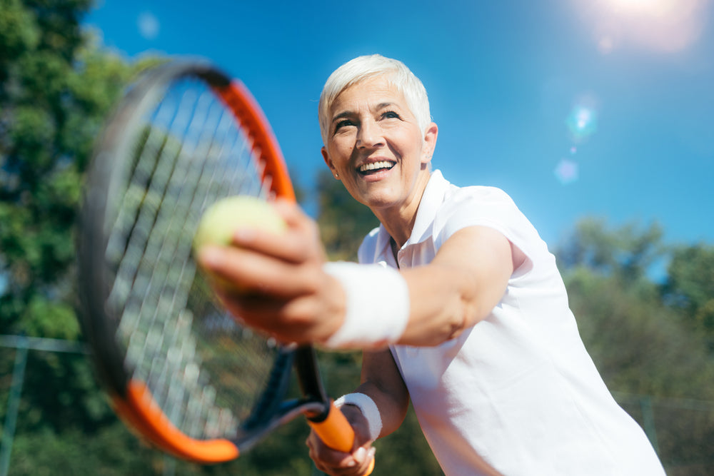 Senior Citizen Woman Playing Tennis