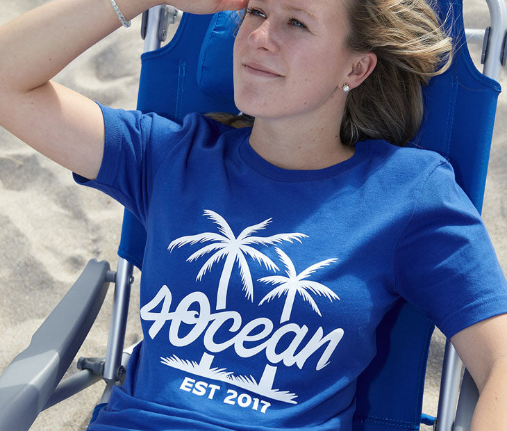 4Ocean Palm Tree Logo T-shirt- royal blue. On female model.