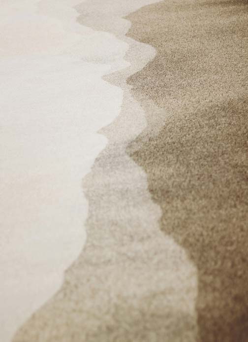 Surf on sandy beach texture