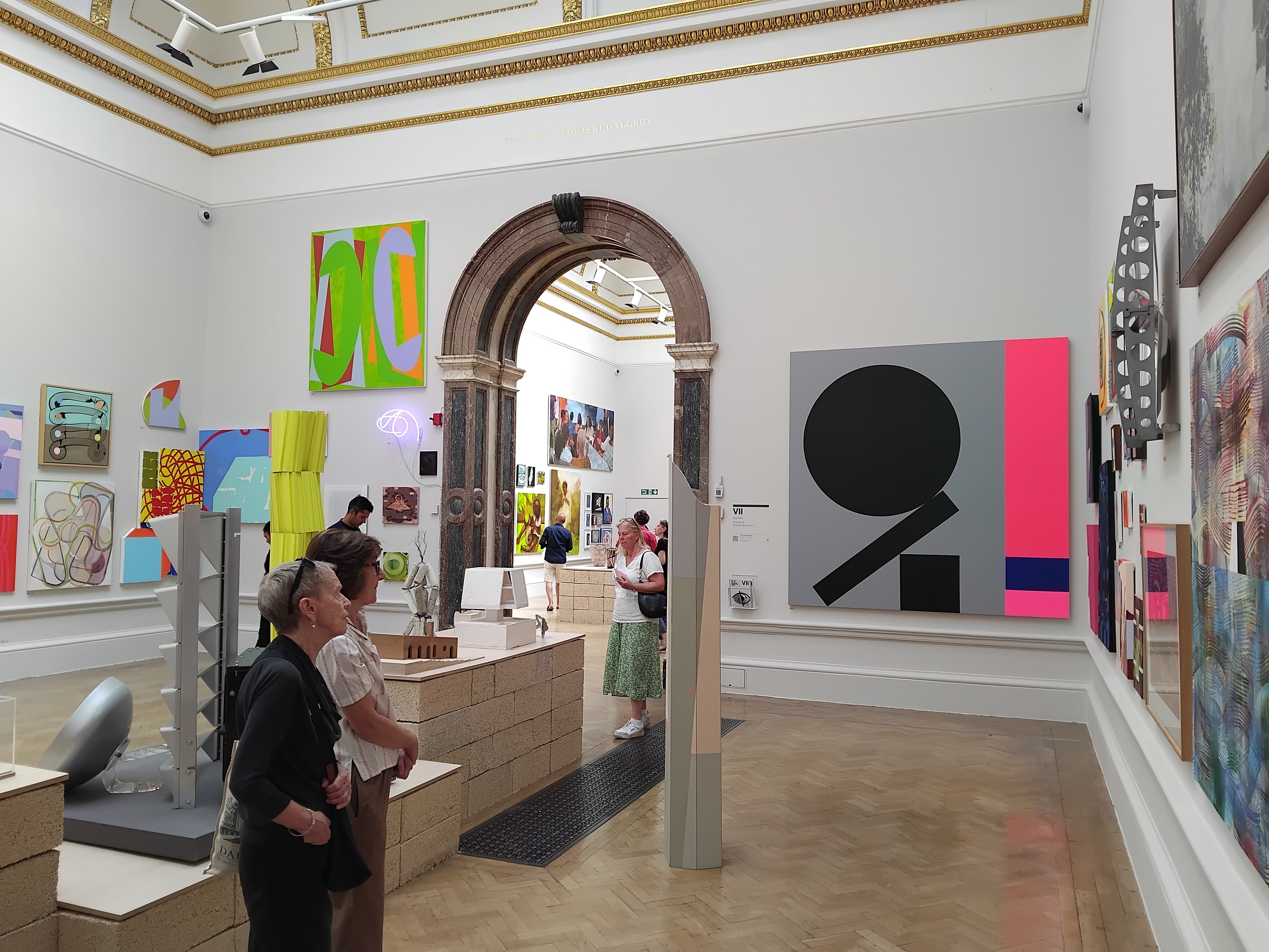 photo of RA Summer Exhibition gallery room with colourful artworks and sculptures