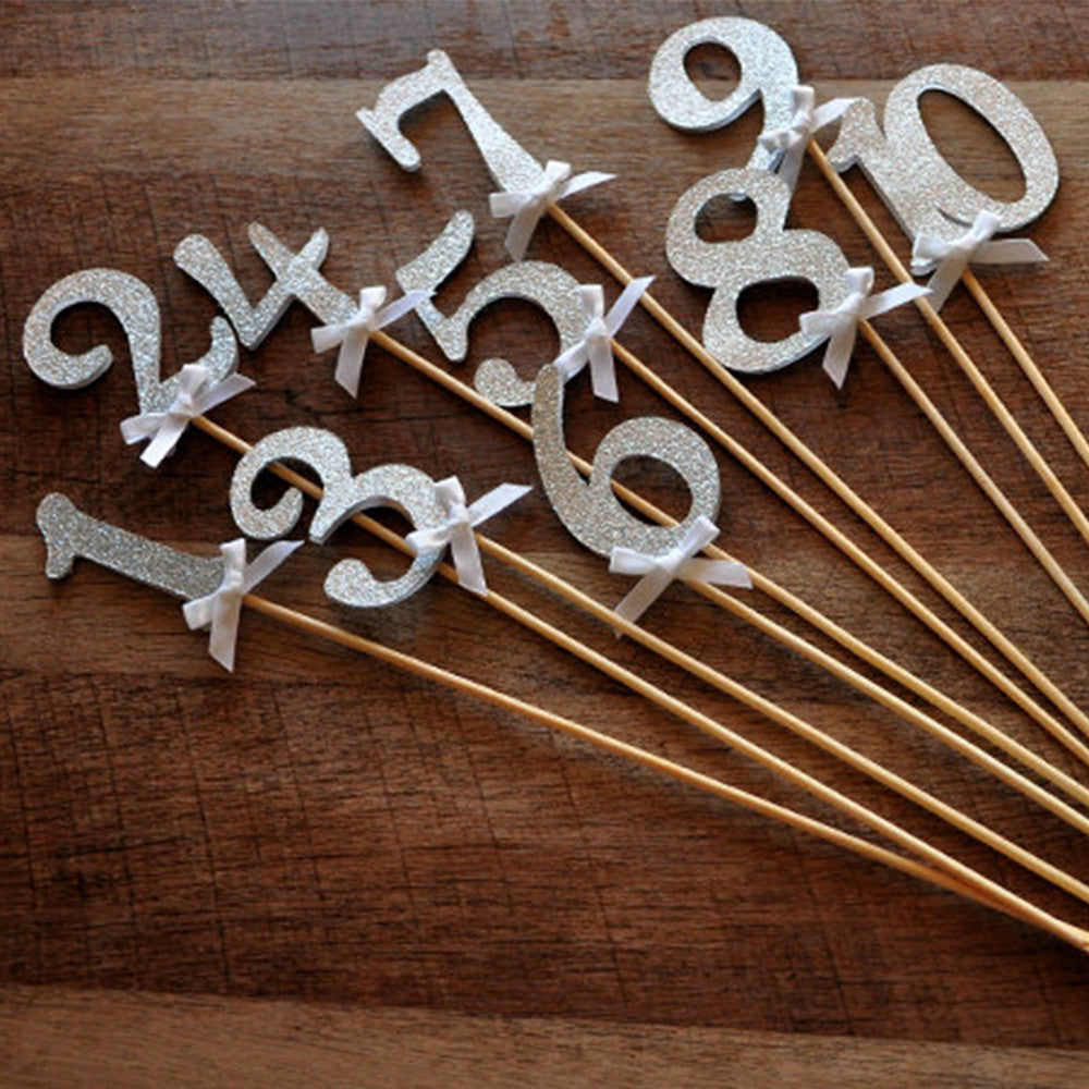 table numbers on sticks in glitter silver silver wedding decor ships