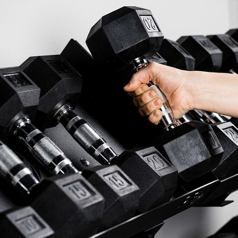 Dumbbell being placed on storage