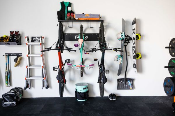 wall storage for bikes, skis, snowboards, etc mounted with stored items