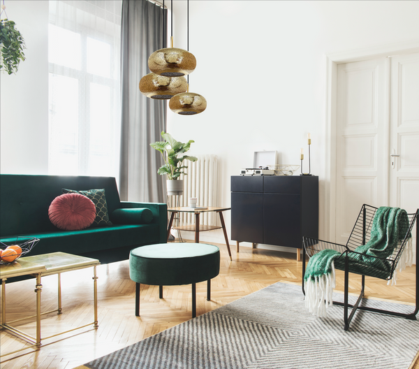 Lila chandelier by dounia home in brass pendant cluster hand made green velvet couch and chair mid-century modern livingroom 