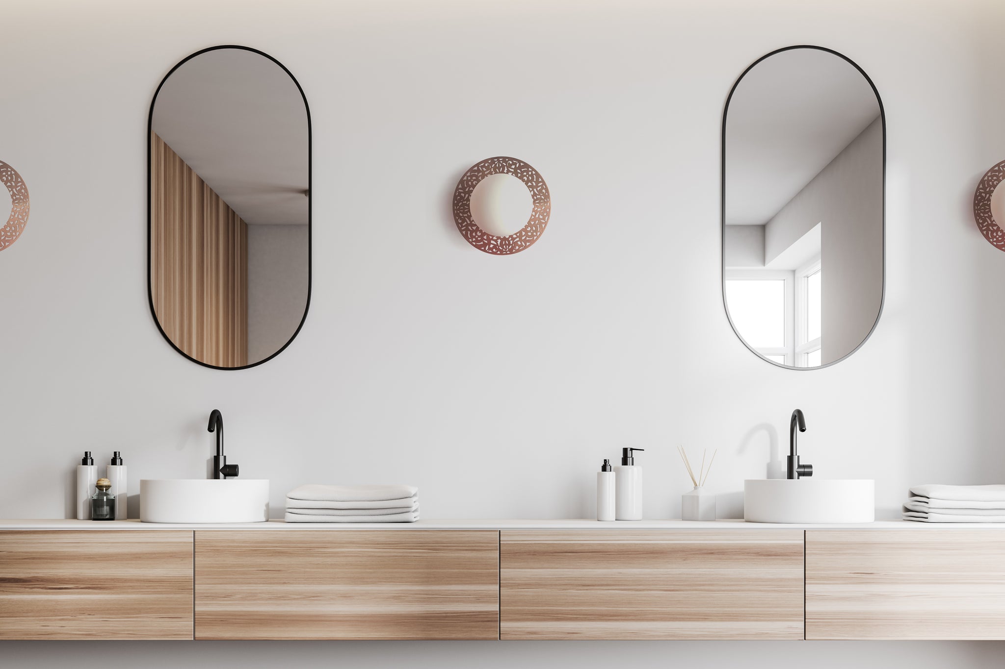round wall sconces by dounia home in modern bathroom 