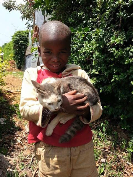 Sponsored Education for children.  One child proud of his cat.