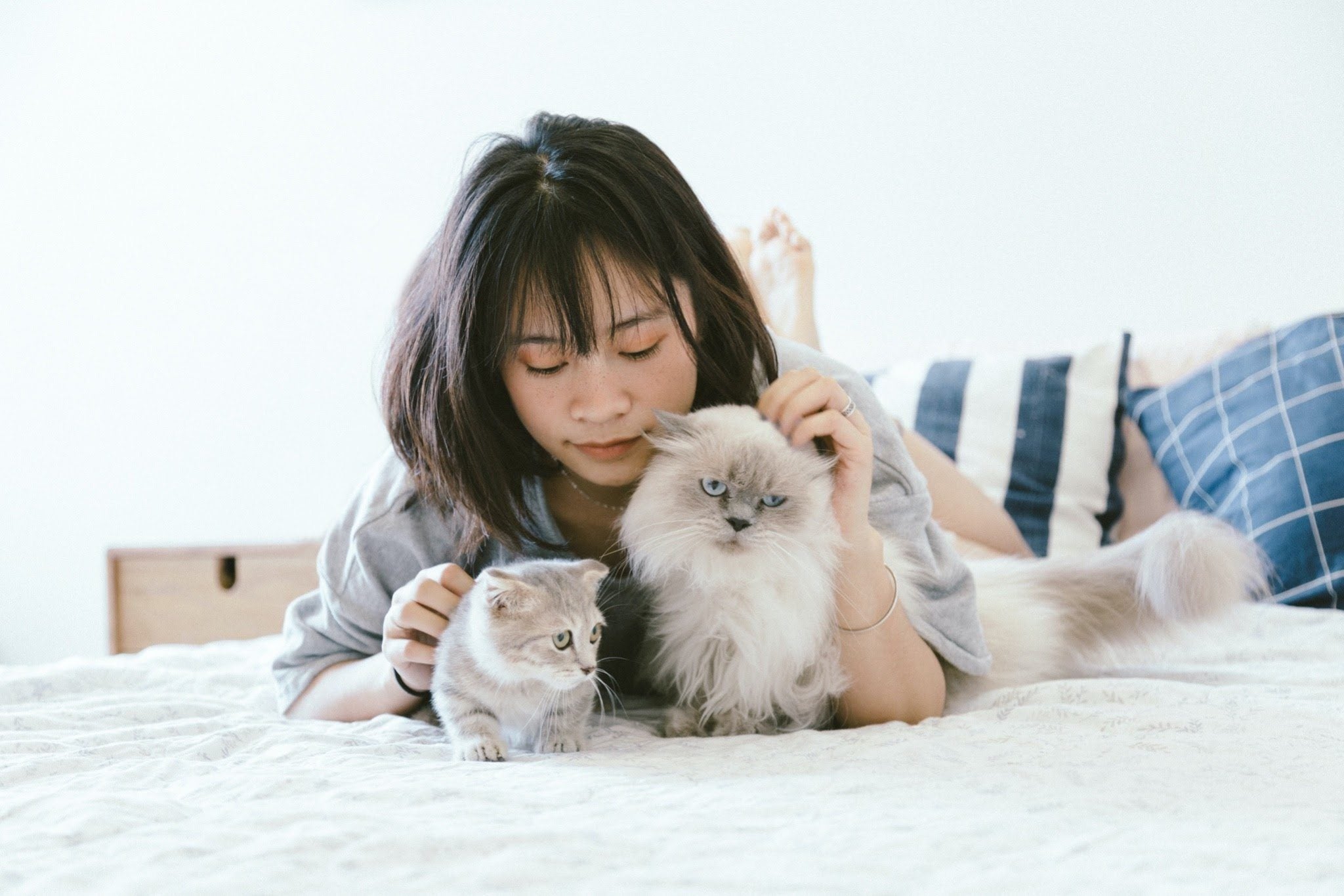 woman with 2 cats