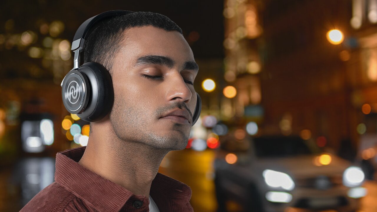 Man wearing Noise Defy headphone with active noise cancellation