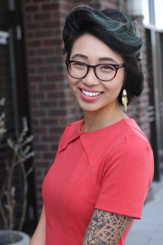 Calgary designer fresh and nimble dot com girl in red dress outside