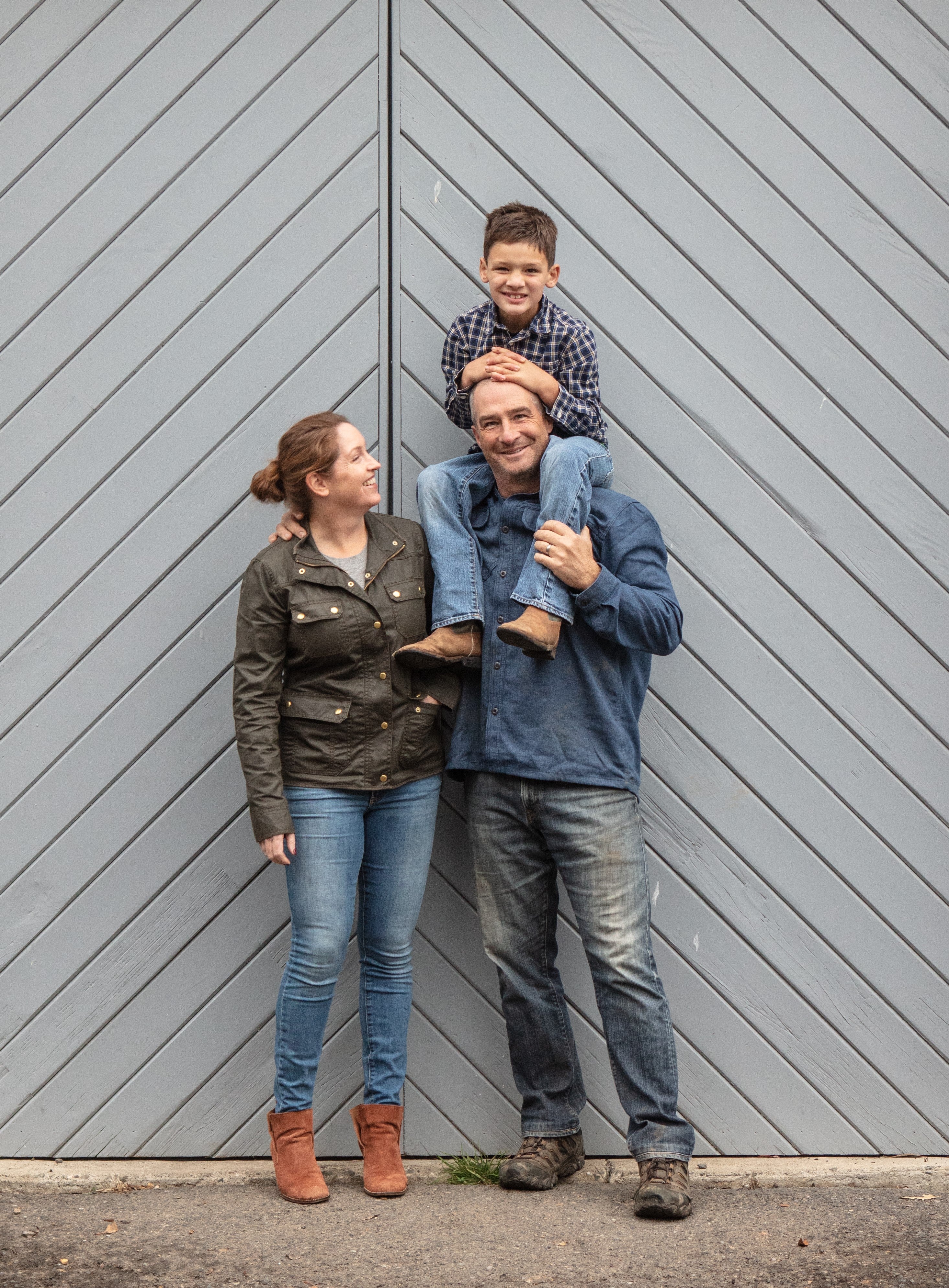 A photo of the Hendry family, with Drew sitting on Mike's shoulders.