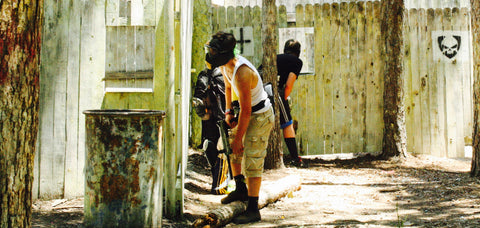 a standoff between the red team and the yellow team at boss paintball