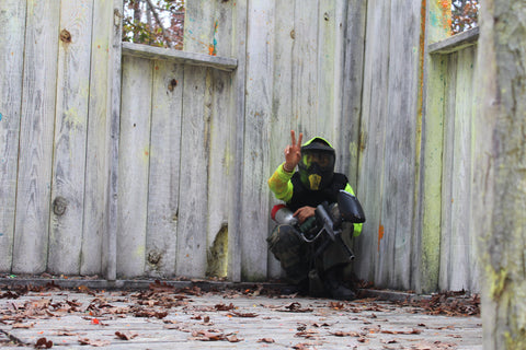 kid with yellow shirt and paintball gun in tower georgetown Boss Paintball