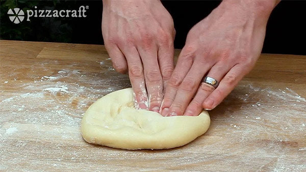 Chef Nick Pounding Pizza Dough