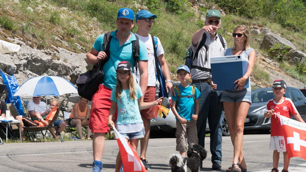 Cycling photography of the Tour de France fans that have almost given up waiting