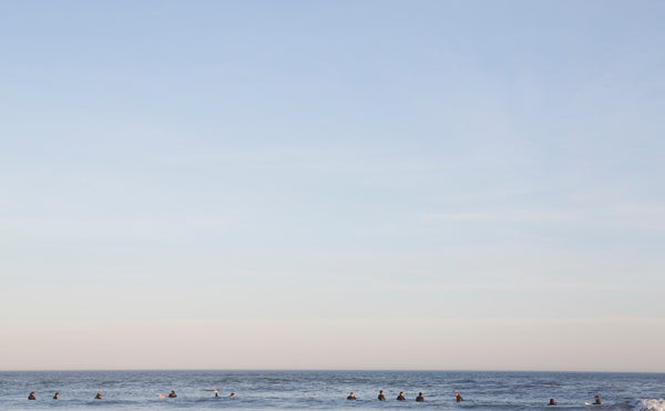 surfers at sea