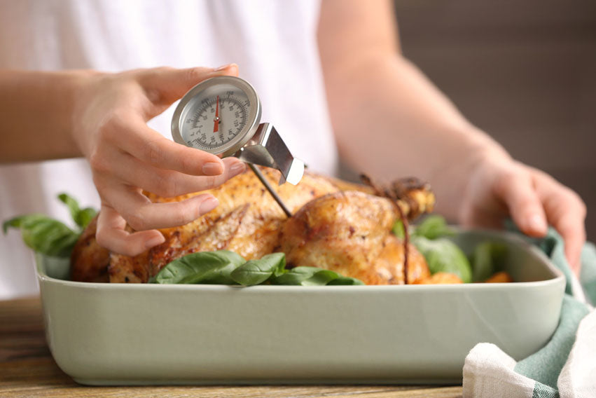 putting instant thermometer into chicken