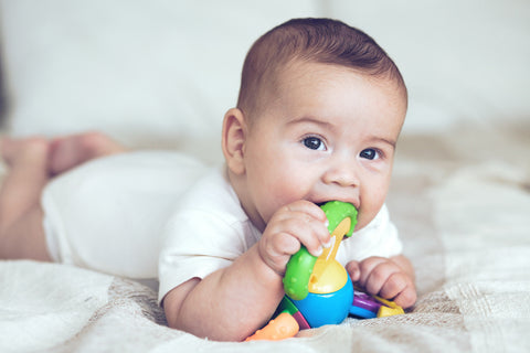 baby chewing plastic toy