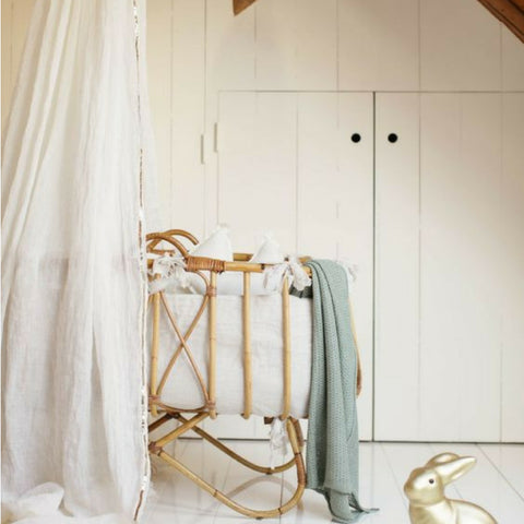 cane crib with voile canopy