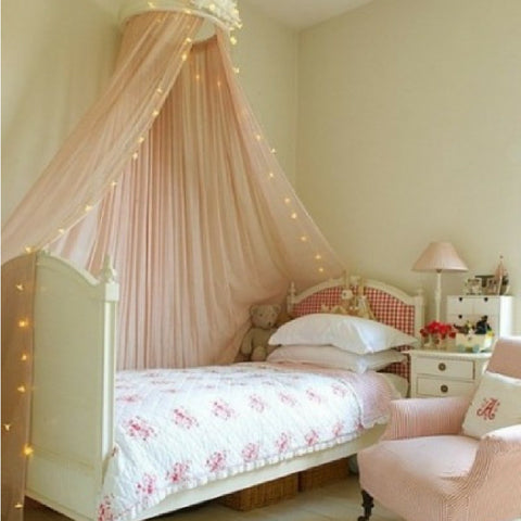 girls bed with pale pink canopy