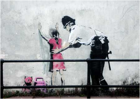 Banksy Policeman Searchin Girl Graffiti - Glastonbury, Somerset