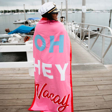 https://cdn.shopify.com/s/files/1/1003/9114/products/girl-using-beach-towel-oh-hey-vacay_large.jpg?v=1643124979