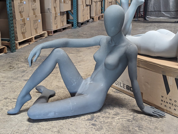 female egghead lounging reclining mannequin