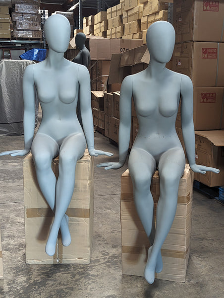 female egghead sitting mannequin