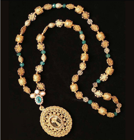 A tambourine necklace with filigree beads, embellished further with emeralds, pearls and diamonds, and a pendant relicario. Circa 19th-20th century.  (Photo from Faith and FIligree: 19th Century Hispano-Filipino Gold Jewellery)