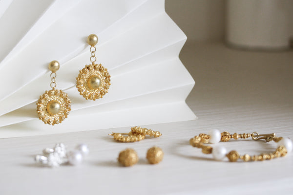 A set of gold filigree jewelry by AMAMI, a contemporary Filipino brand that aims to preserve the tradition of tamborin-making through exciting new designs.