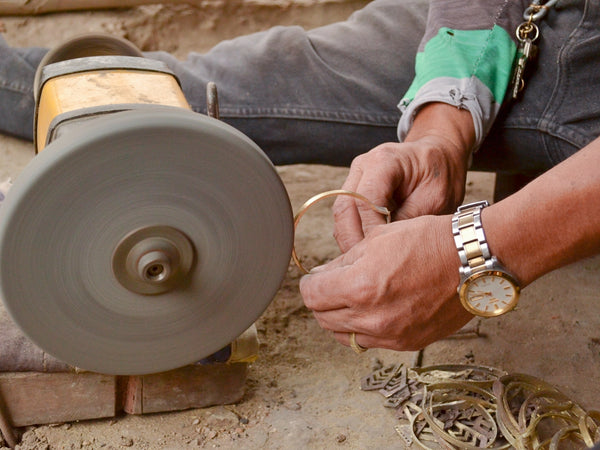 The final step of the temwel process is cleaning and polishing their brass works of art.