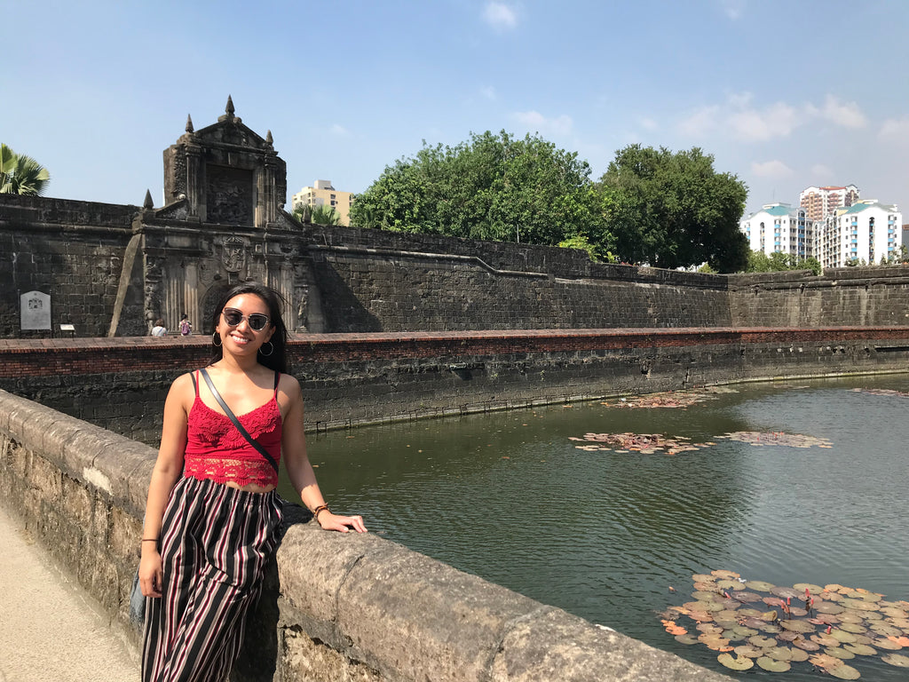 Justine Abigail Yu in front of Manila's Pasig River