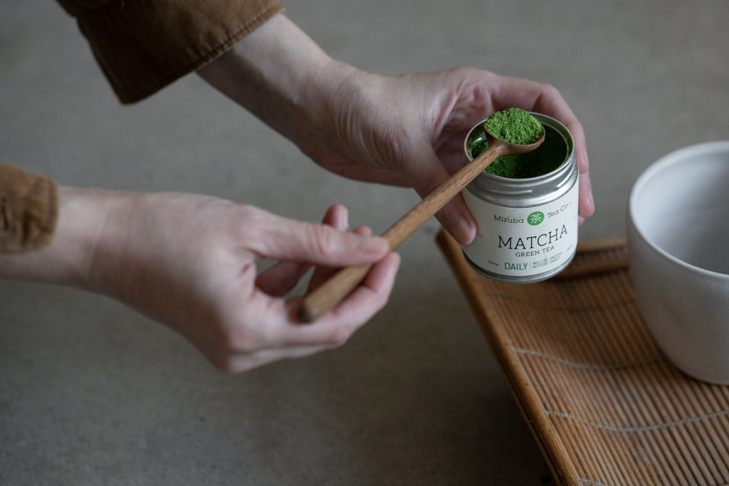 Scooping out matcha powder