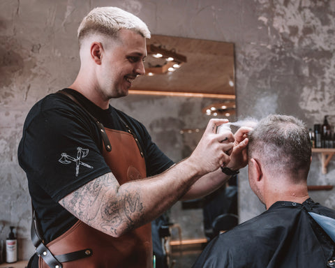 barber using hair styling powder