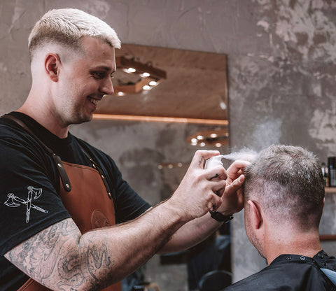 barber applying hair styling powder