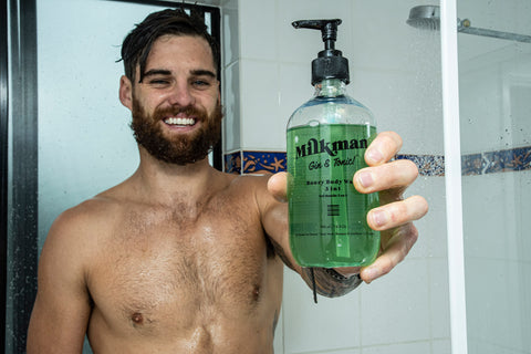 bearded man holding gin and tonic boozy body wash