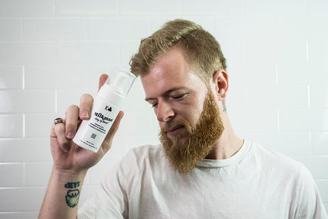 man holding milkman beard 2 in 1 shampoo conditioner