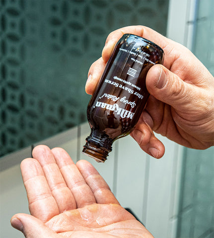 man splashing out after shave