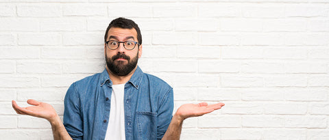 bearded man in questioning pose
