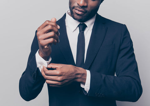 man with stubble wearing suit