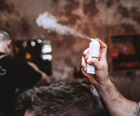 barber using milkman hair styling powder