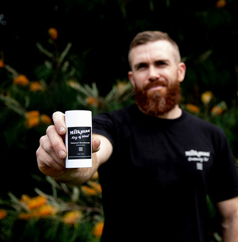 man holding milkman natural deodorant