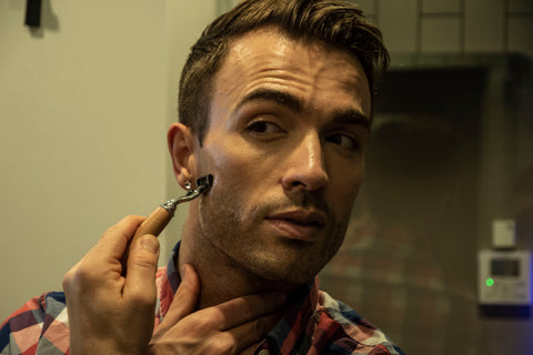 man shaving with mach III compatible razor