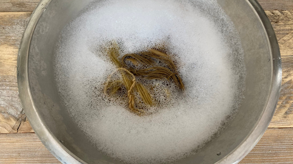 Yarns in soapy water