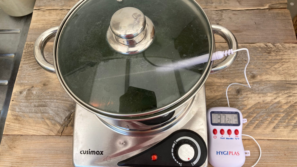Dye pot on hob with thermometer