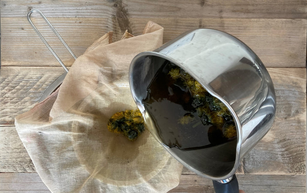 Straining the dandelion dye bath