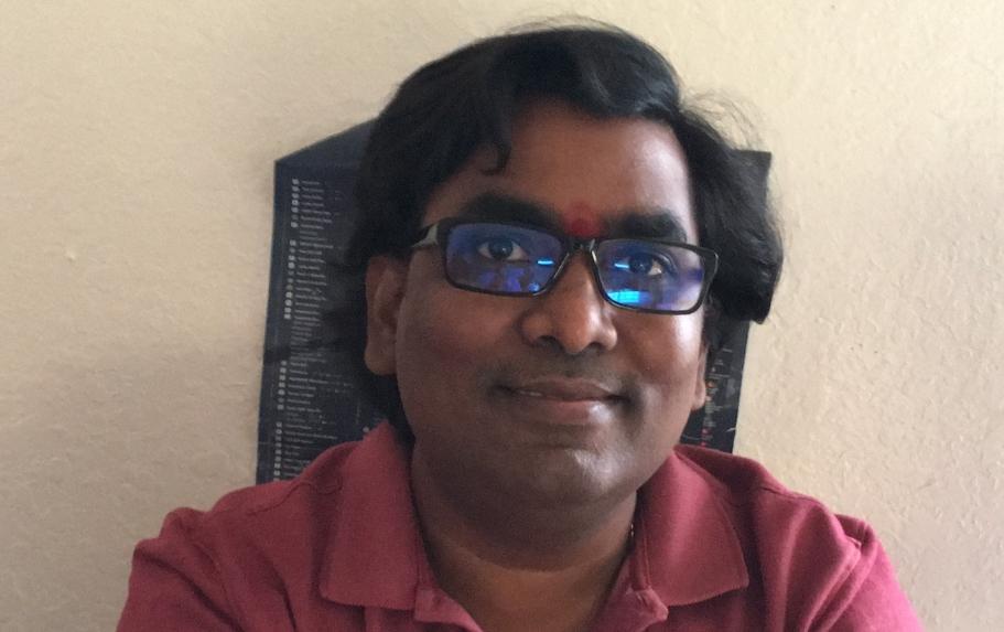 Chandrra uses his Umizato blue light glasses while on laptop