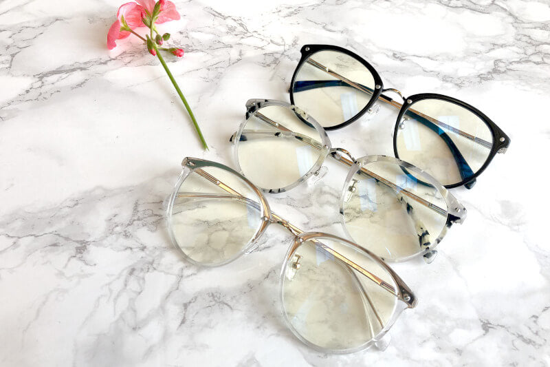 Rei blue light glasses on marble background